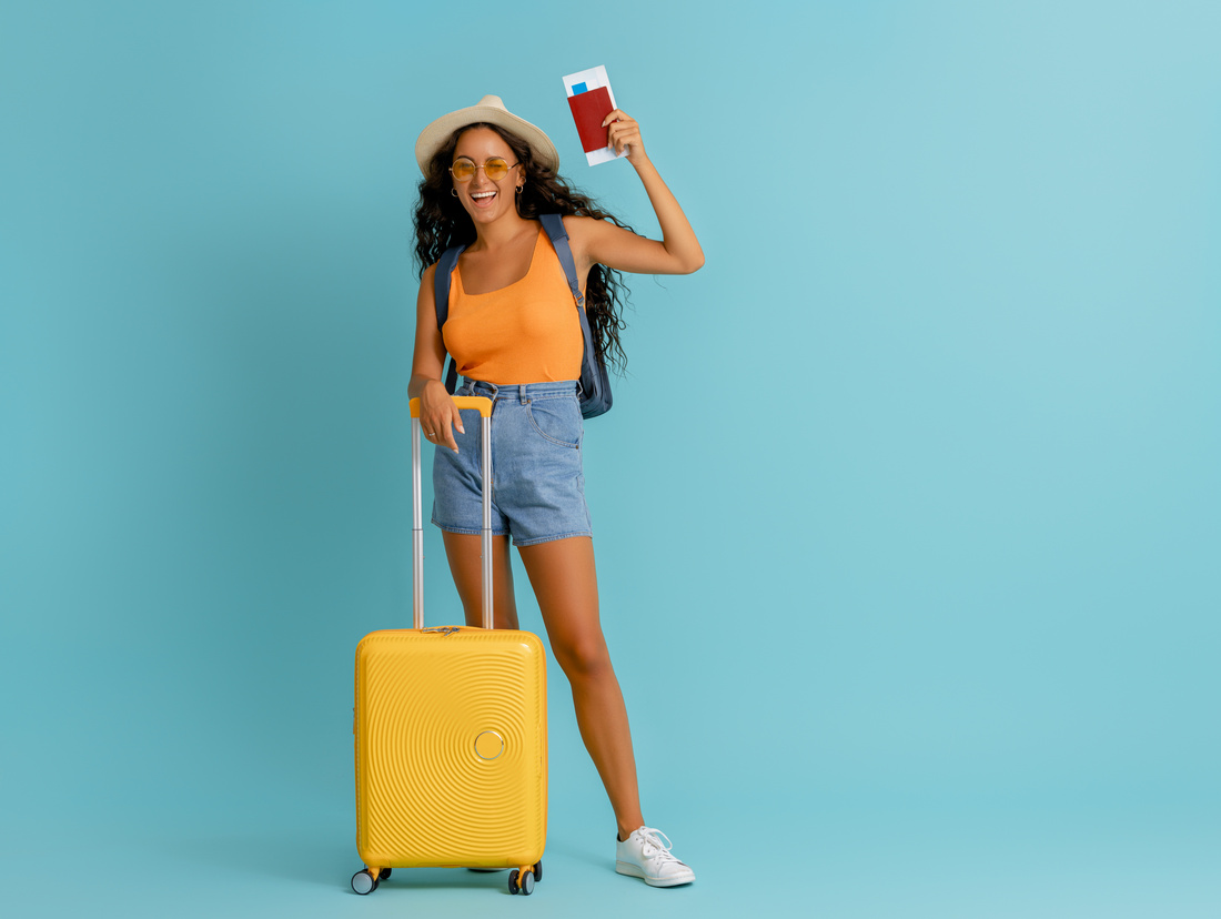 Woman Tourist Holding Passport and Luggage 